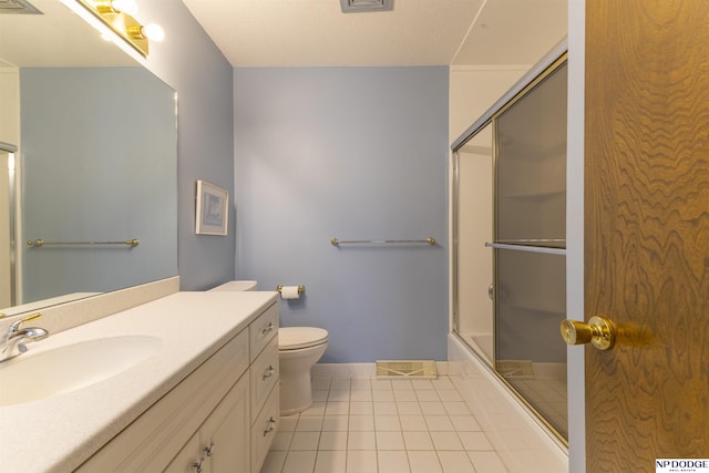 bathroom with tile patterned floors, visible vents, toilet, shower / bath combination with glass door, and vanity