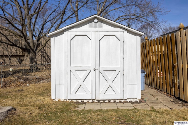 view of shed featuring a fenced backyard