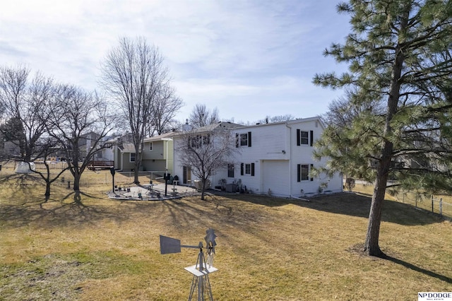 rear view of house with a patio area, a yard, and fence