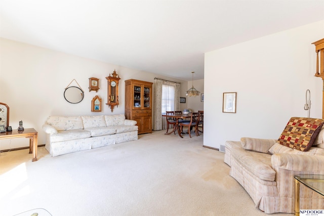 living room with light colored carpet and baseboards