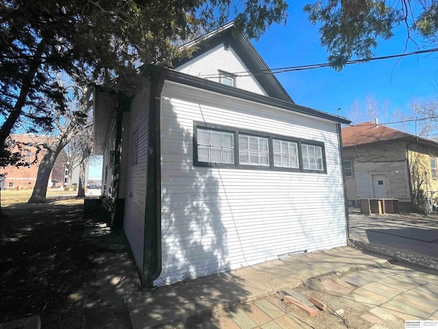 view of side of home with a patio