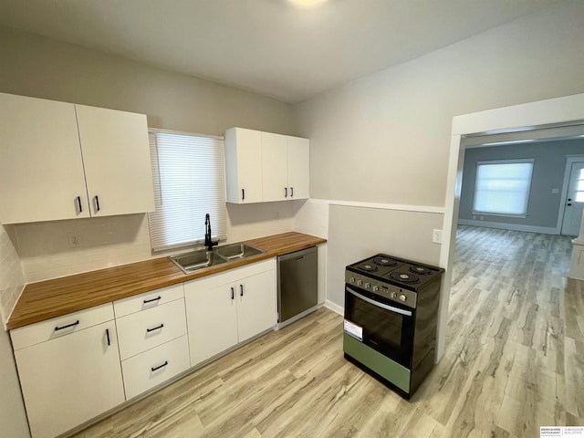 kitchen with black / electric stove, stainless steel dishwasher, light wood-style floors, wood counters, and a sink