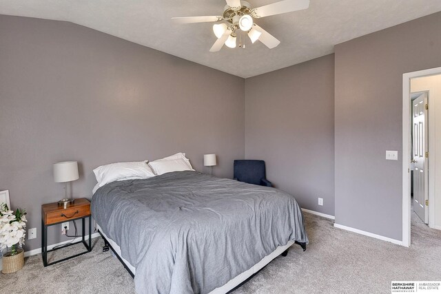 bedroom featuring ceiling fan, lofted ceiling, baseboards, and carpet floors