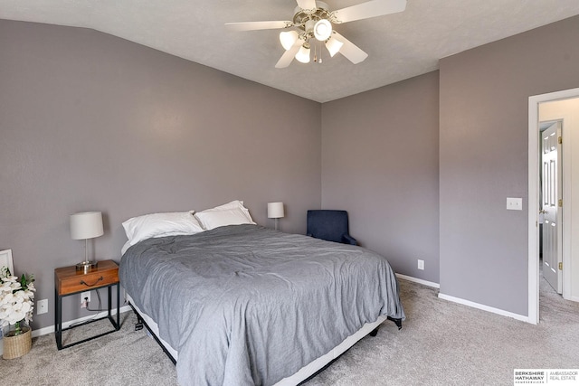 bedroom with vaulted ceiling, a ceiling fan, baseboards, and carpet floors