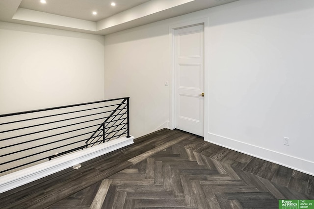 empty room featuring recessed lighting and baseboards