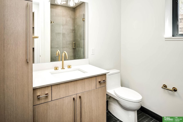 bathroom with vanity, toilet, and tiled shower