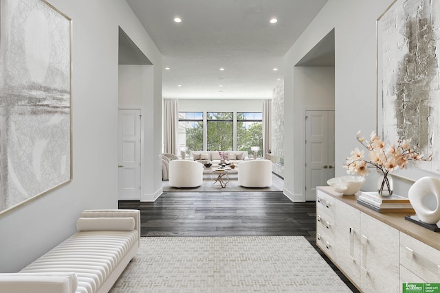 corridor featuring recessed lighting and dark wood-style flooring