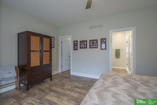 bedroom with dark wood finished floors, visible vents, a ceiling fan, and baseboards