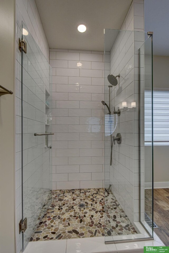 bathroom with a shower stall