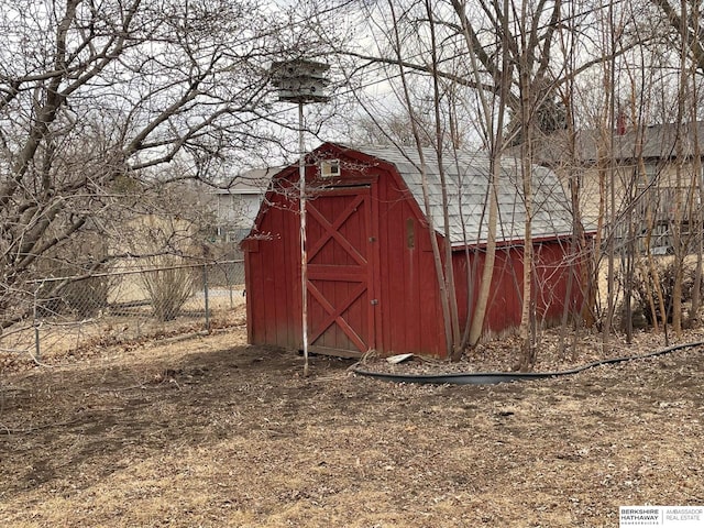 view of outbuilding featuring an outbuilding and fence