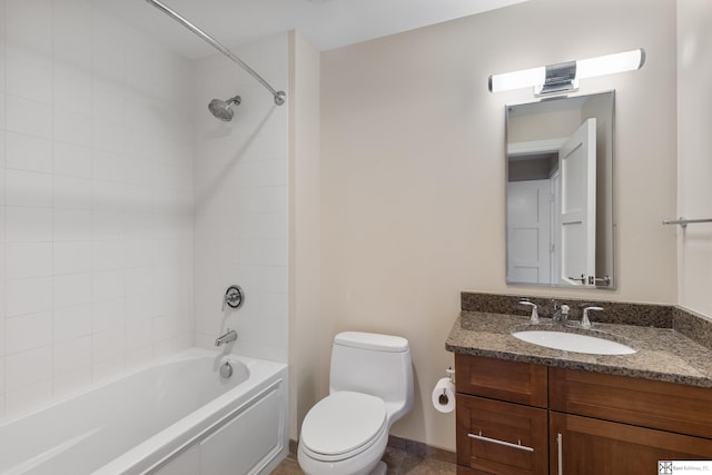 bathroom featuring baseboards, vanity, toilet, and shower / bathtub combination