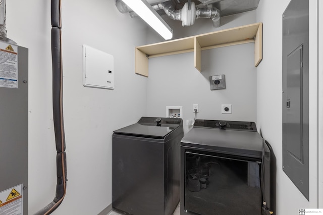 clothes washing area with laundry area and washer and clothes dryer