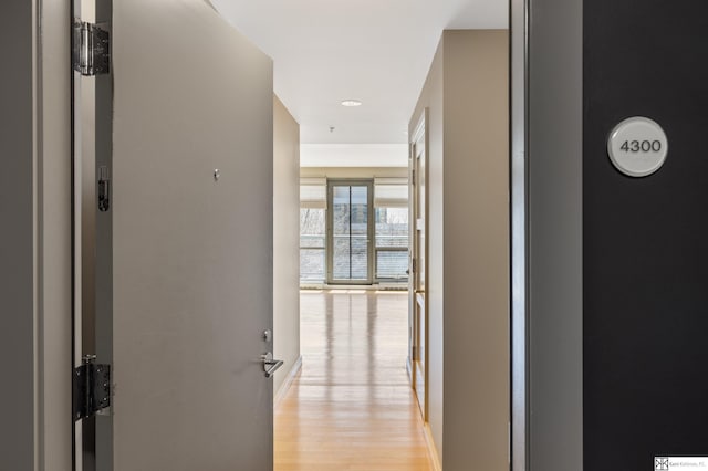 corridor featuring light wood-style flooring