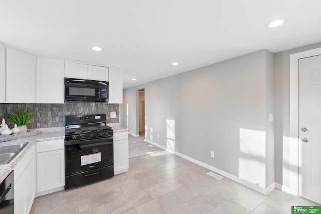 kitchen featuring recessed lighting, backsplash, white cabinets, and black appliances