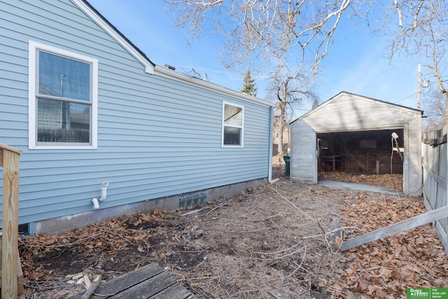 view of side of property featuring an outbuilding and a storage unit