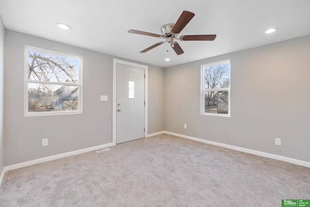 carpeted entryway featuring visible vents, recessed lighting, baseboards, and ceiling fan