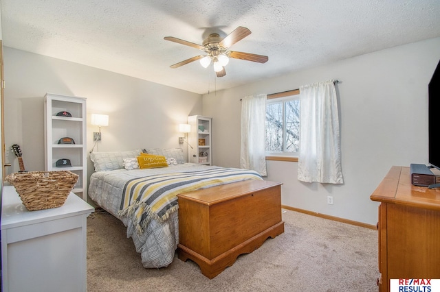 bedroom with baseboards, carpet floors, a textured ceiling, and ceiling fan