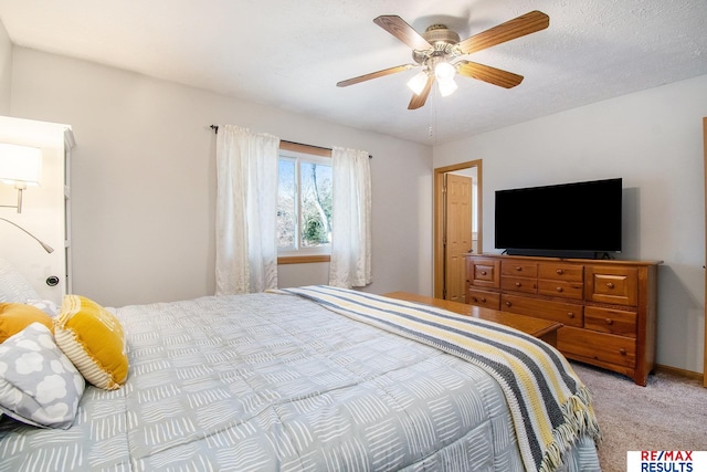 bedroom with light colored carpet, a textured ceiling, and ceiling fan