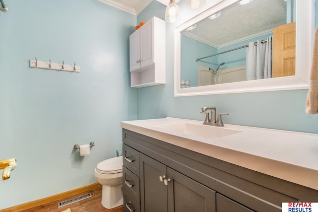 bathroom with visible vents, curtained shower, crown molding, toilet, and wood finished floors