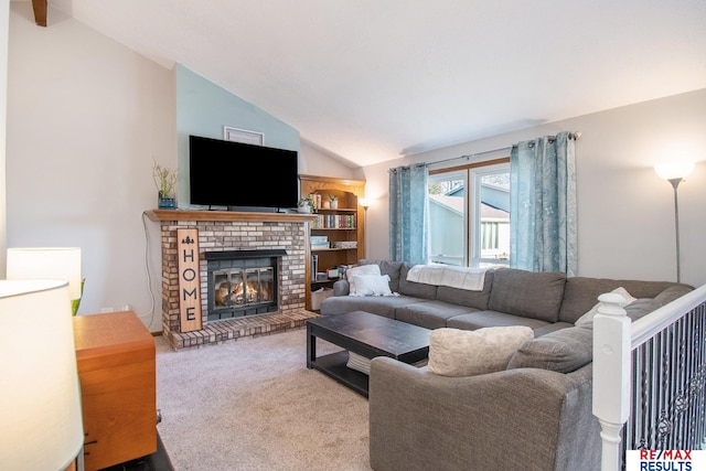 carpeted living area with a fireplace and vaulted ceiling