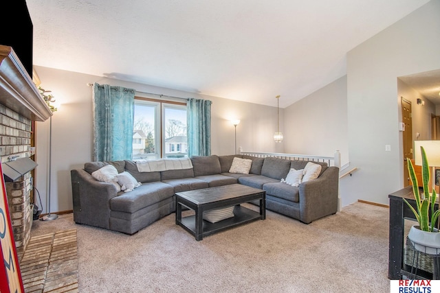 carpeted living room with a fireplace, baseboards, and vaulted ceiling