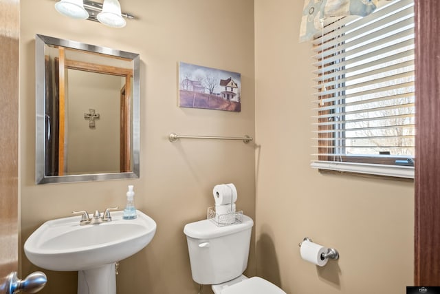 bathroom featuring a sink and toilet