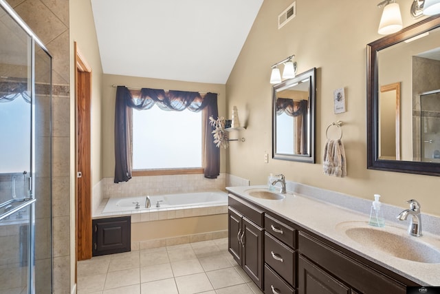 full bath with visible vents, a stall shower, lofted ceiling, and a sink