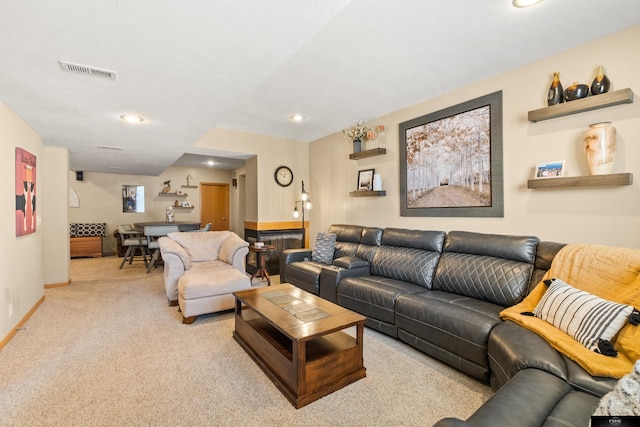 carpeted living area with recessed lighting, baseboards, and visible vents