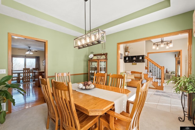 dining area featuring stairway