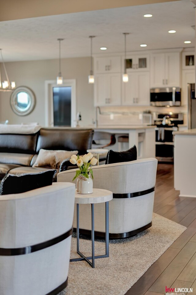 living room featuring recessed lighting and light wood finished floors