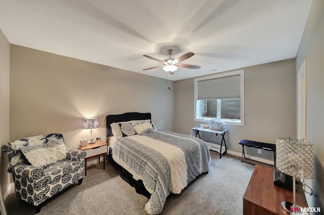 bedroom with baseboards, carpet, and a ceiling fan