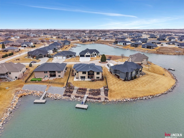 aerial view with a residential view and a water view