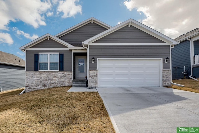 view of front of house with concrete driveway, an attached garage, stone siding, and a front yard