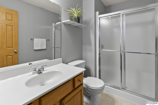 full bathroom with a shower stall, toilet, and vanity