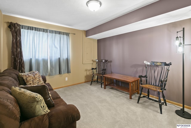 sitting room with carpet and baseboards