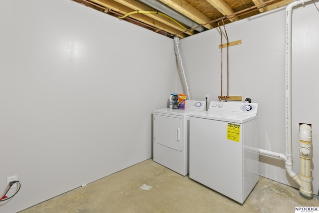 laundry area featuring washer and dryer and laundry area