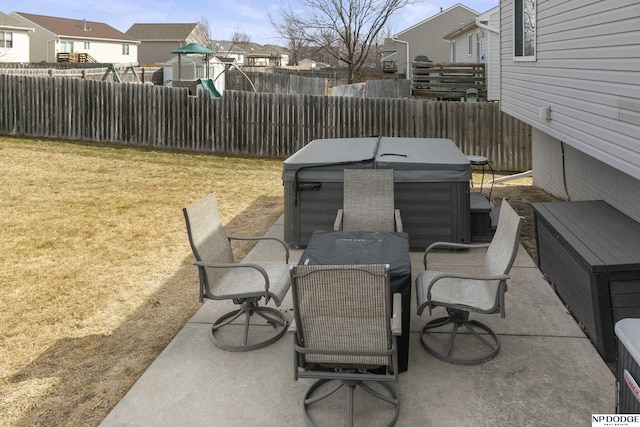 view of patio with a residential view, a playground, outdoor dining area, and a fenced backyard