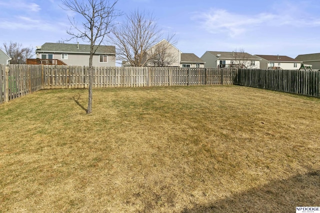 view of yard featuring a fenced backyard