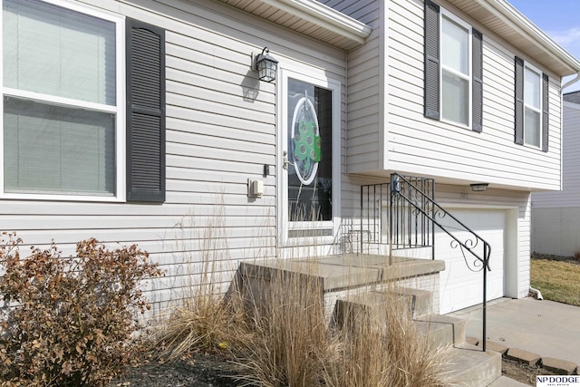 view of exterior entry featuring a garage