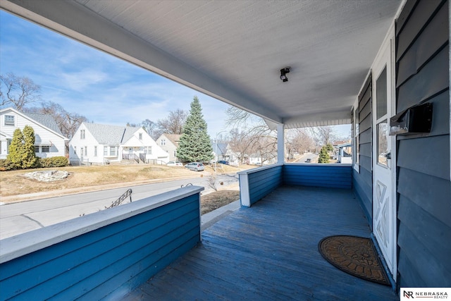 balcony with a residential view and covered porch