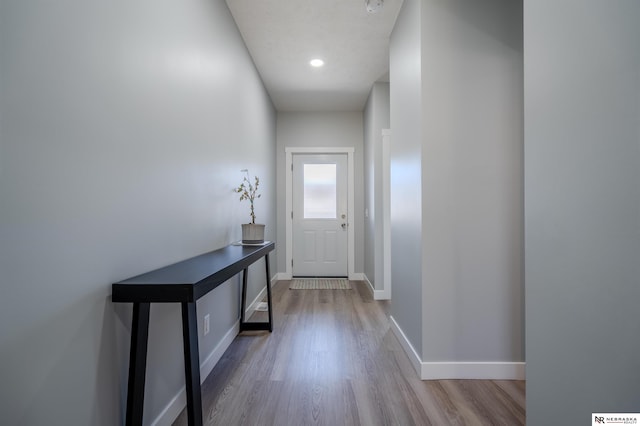 entryway with recessed lighting, baseboards, and wood finished floors