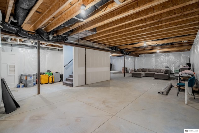 unfinished basement with stairs