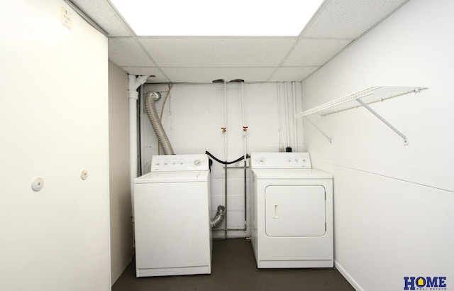 laundry room with laundry area and washing machine and clothes dryer