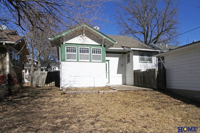 view of front of house with fence