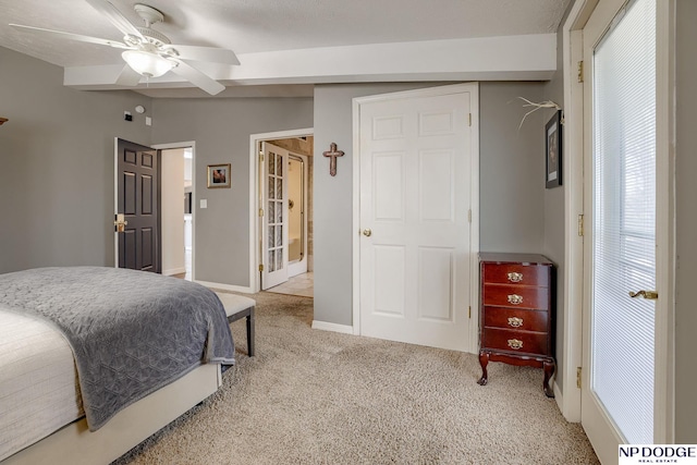 carpeted bedroom featuring lofted ceiling, a ceiling fan, and baseboards