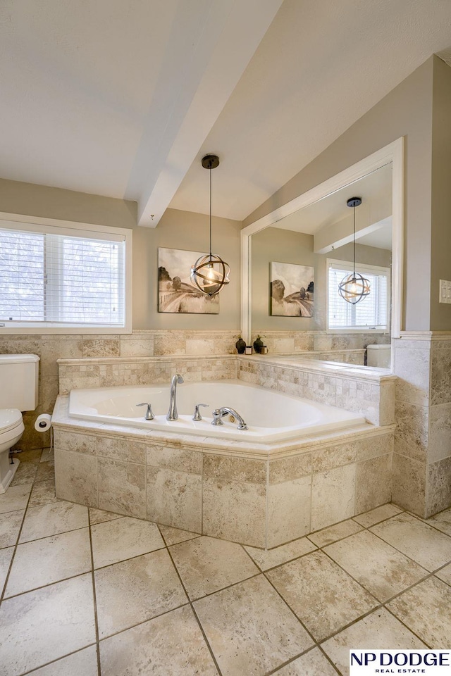 full bath featuring vaulted ceiling with beams, toilet, and a garden tub