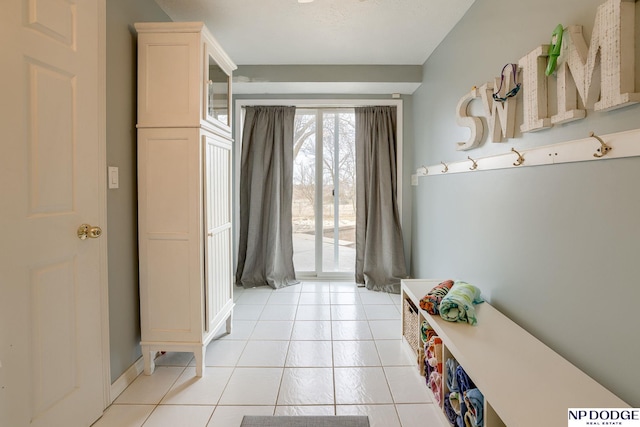 mudroom with light tile patterned floors