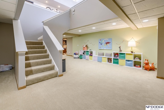 recreation room with recessed lighting, baseboards, a paneled ceiling, and carpet flooring