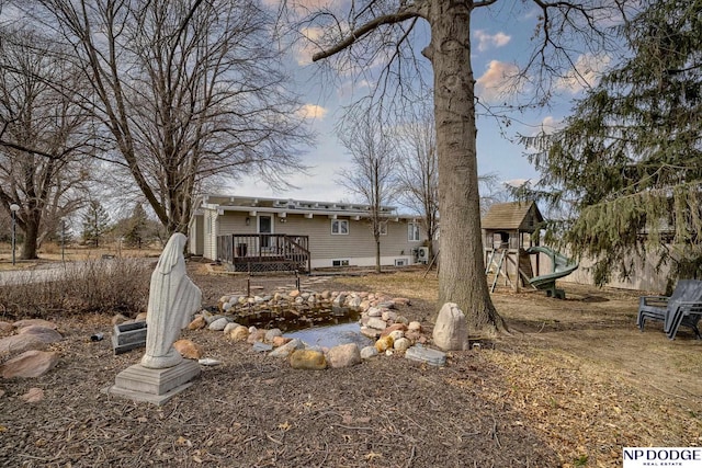 rear view of house with a playground