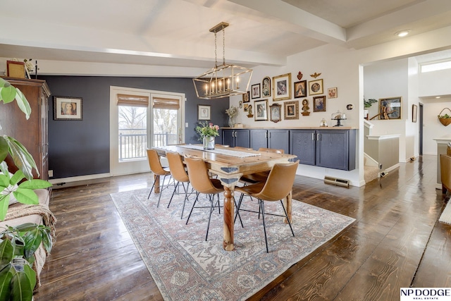 dining area with baseboards, beam ceiling, dark wood-type flooring, and a notable chandelier